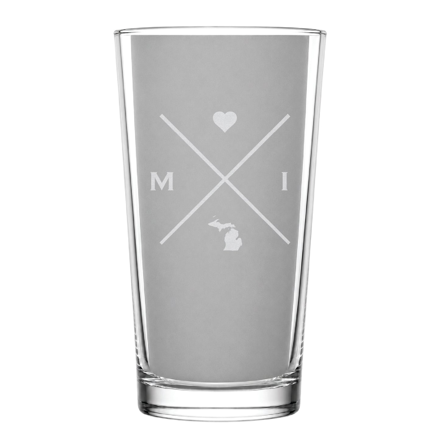 Clear pint glass with engraved Michigan crossed-line design, heart icon, and Michigan silhouette on a clean light background