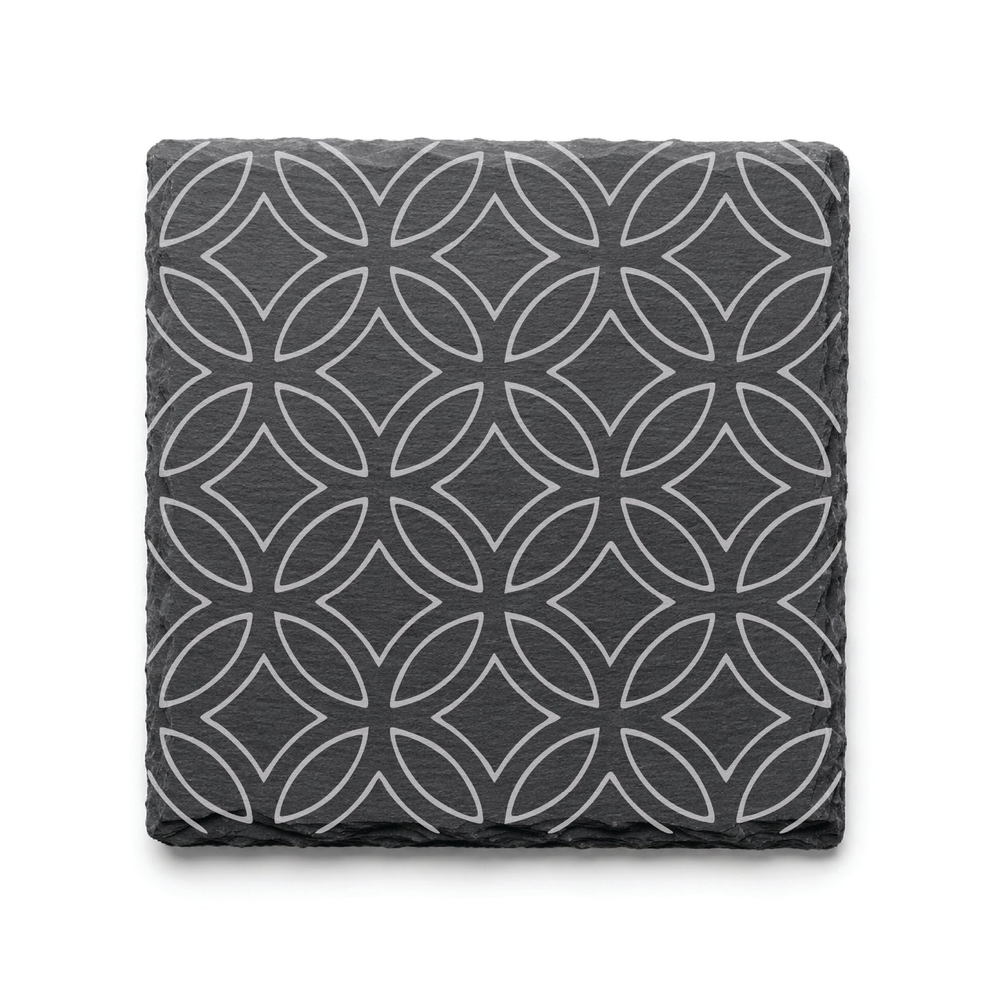 Geometric circle slate coaster with engraved repeating circular pattern on natural black slate background.
