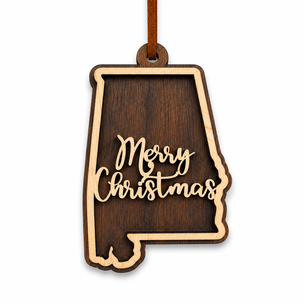 Wooden ornament shaped like the state of Alabama with 'Merry Christmas' text on a white background