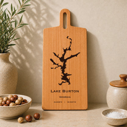 Lake Burton engraved serving board displayed on a neutral kitchen countertop with ceramic decor