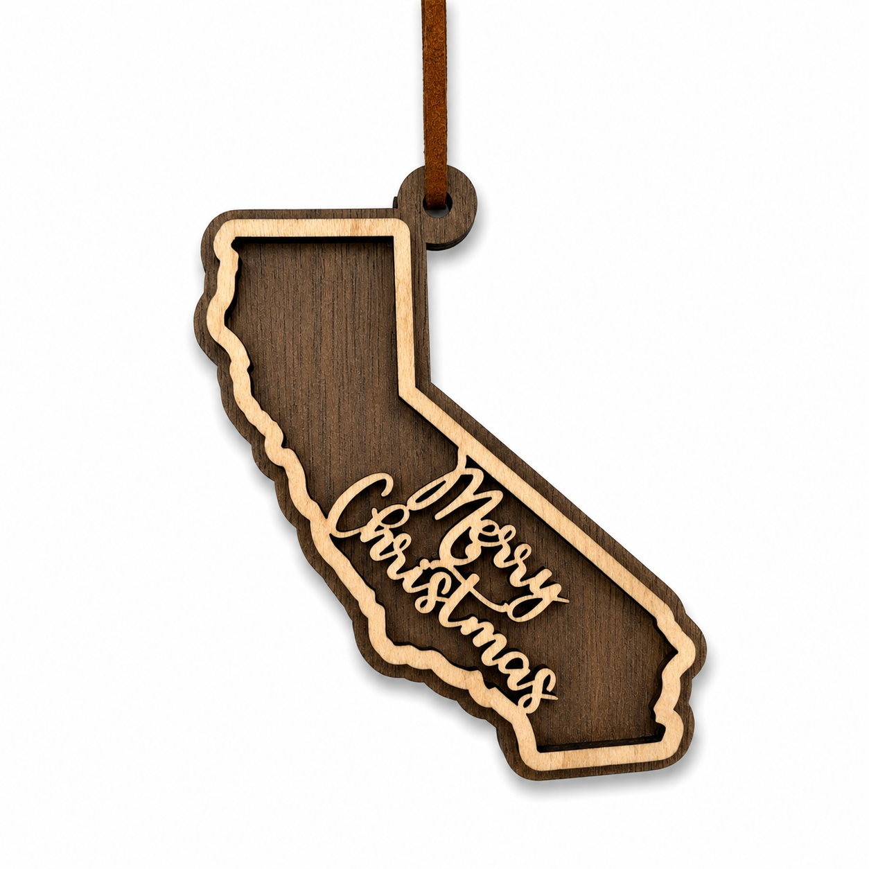 Wooden ornament shaped like the state of California with 'Merry Christmas' text on a white background