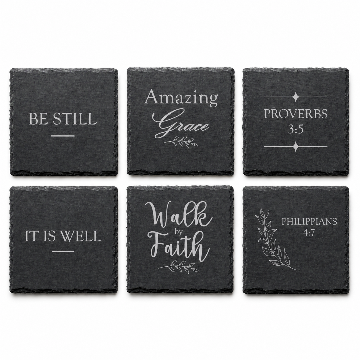 Six engraved Christian slate coasters arranged in a grid showing Be Still, Amazing Grace, Walk by Faith, It Is Well, Proverbs 3:5, and Philippians 4:7 designs on a white background.