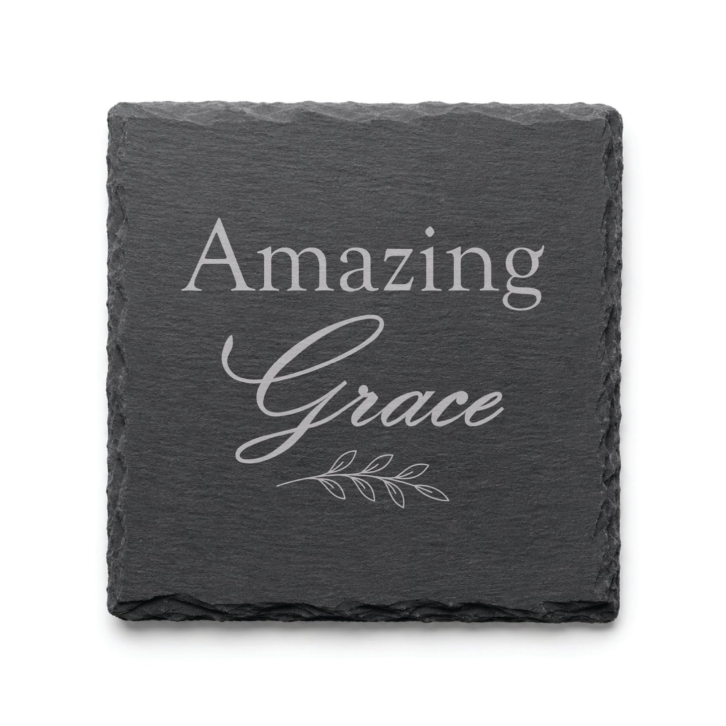 Black slate coaster engraved with the words Amazing Grace and a delicate botanical branch design.