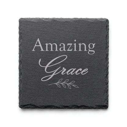 Black slate coaster engraved with the words Amazing Grace and a delicate botanical branch design.