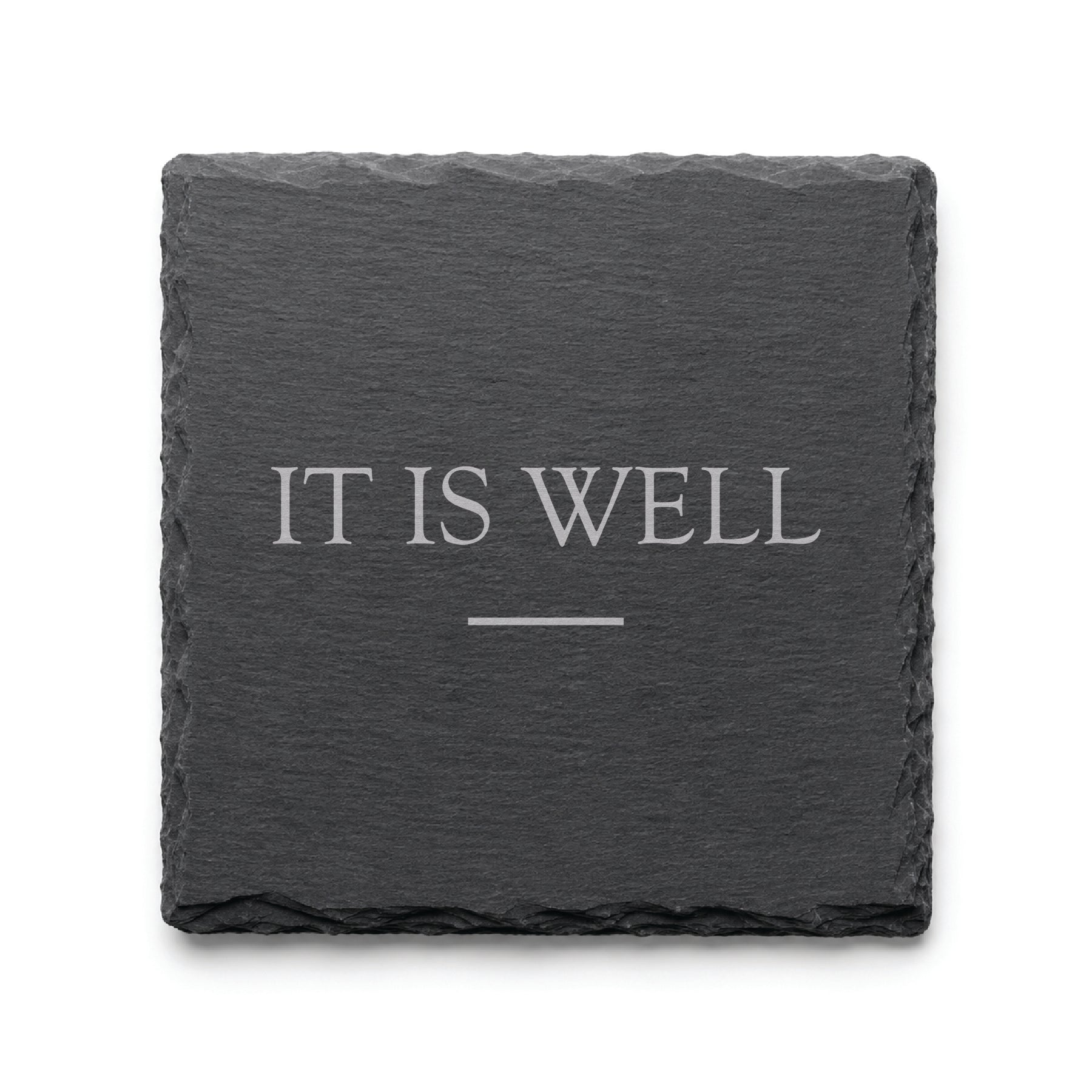 Black slate coaster engraved with the phrase It Is Well and a simple decorative line.