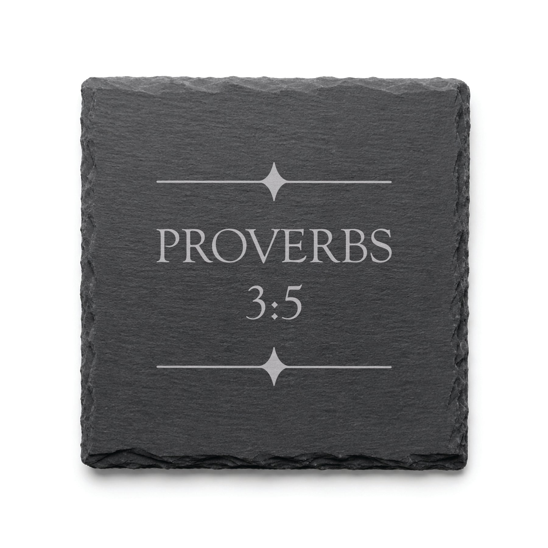 Black slate coaster engraved with Proverbs 3:5 and decorative starburst divider elements.