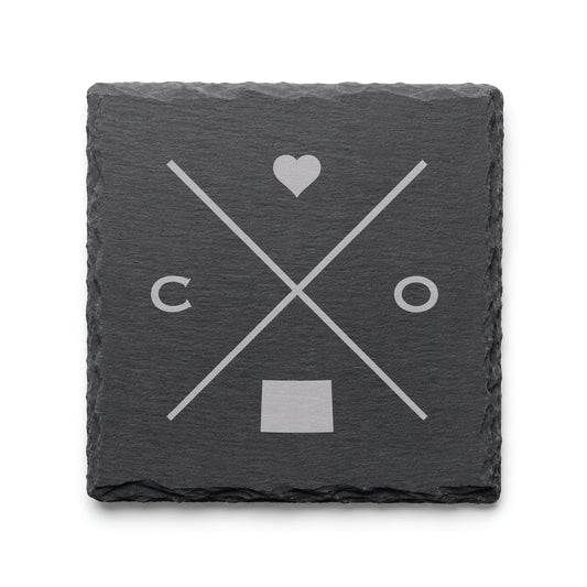 Dark slate coaster with engraved Colorado crossed-line design, heart icon, and Colorado silhouette on a dark background.