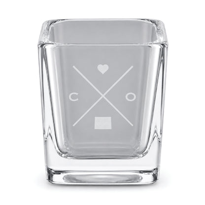 Clear engraved Colorado shot glass featuring a minimalist crossed-line design with heart detail and Colorado silhouette on a clean light background.