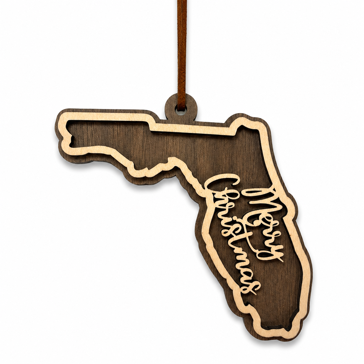 Wooden ornament shaped like the state of Florida with 'Merry Christmas' text on a white background