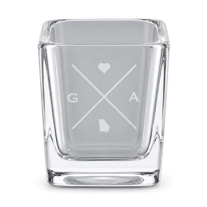 Clear engraved Georgia shot glass featuring a minimalist crossed-line design with heart detail and Georgia silhouette on a clean light background.