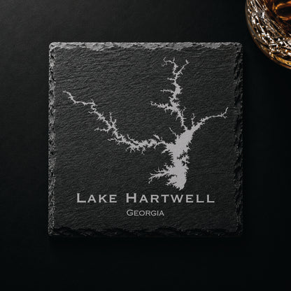 Dark slate coaster engraved with a detailed Lake Hartwell map and Georgia text on a dark background.