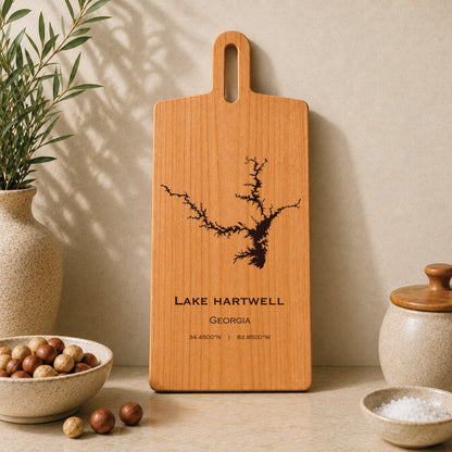 Lake Hartwell engraved serving board displayed on a neutral kitchen countertop with ceramic decor