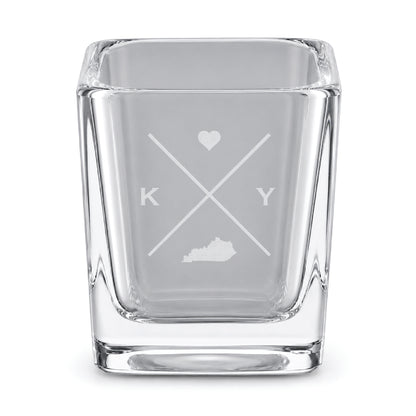 Clear engraved Kentucky shot glass featuring a minimalist crossed-line design with heart detail and Kentucky silhouette on a clean light background.