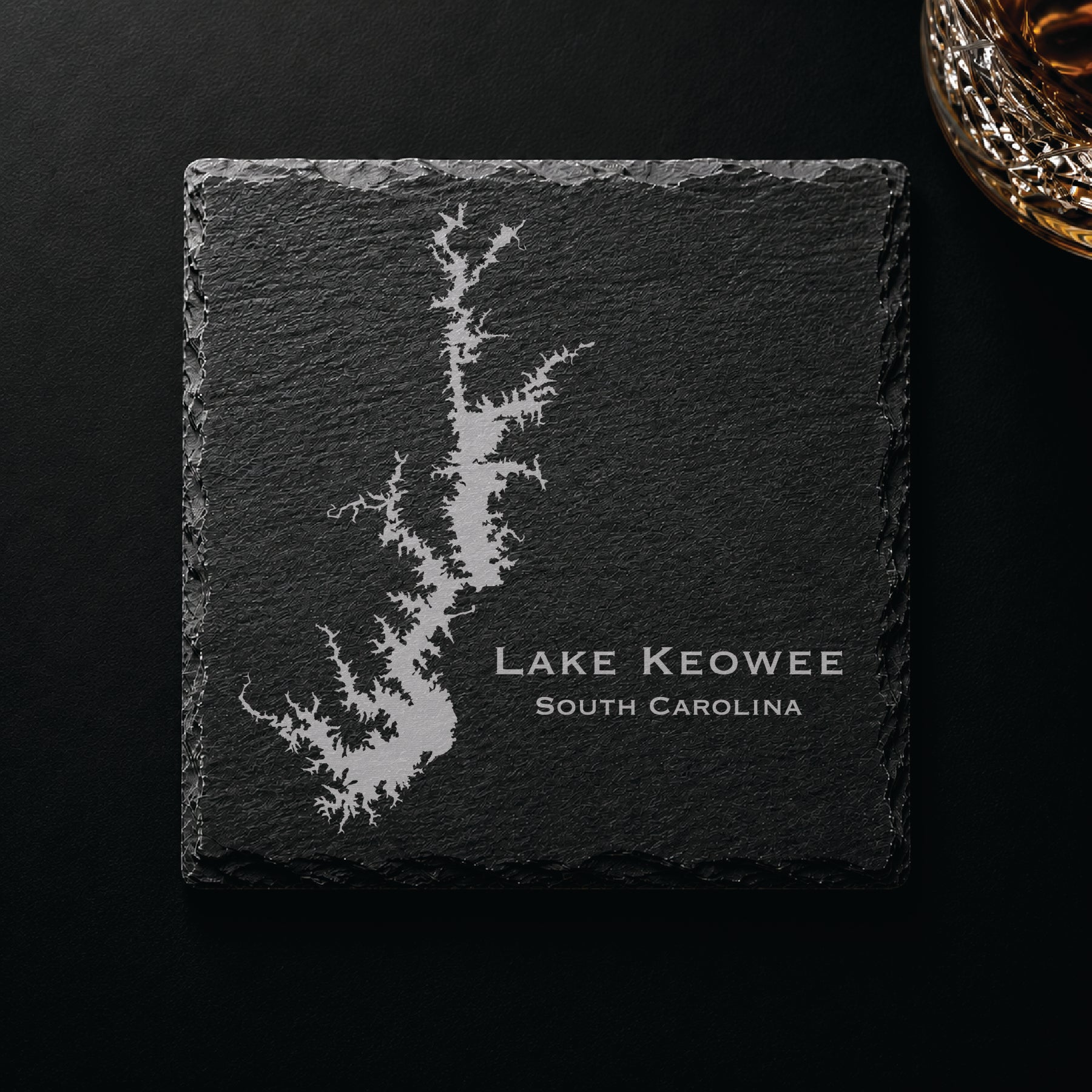 Dark slate coaster engraved with a detailed Lake Keowee map and South Carolina text on a dark background.