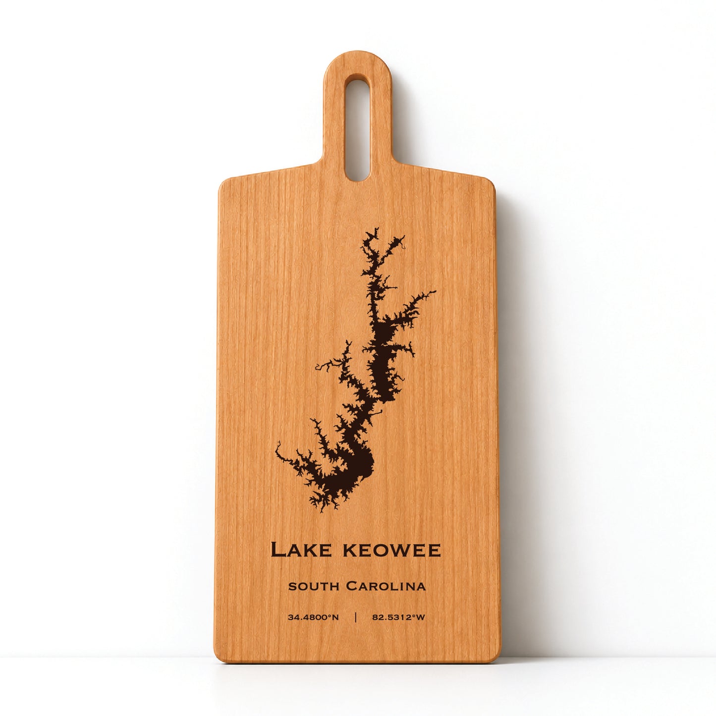 Minimal cherry wood serving board featuring engraved Lake Keowee shoreline and coordinates