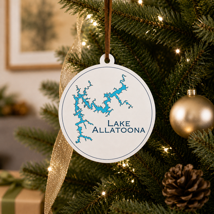 White Lake Allatoona ornament hanging on a decorated Christmas tree with warm lights and gold ribbon.