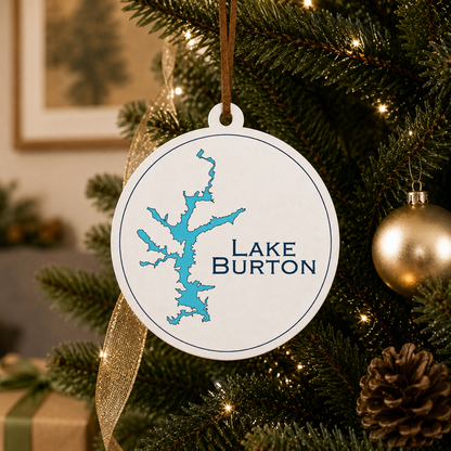 White Lake Burton ornament hanging on a decorated Christmas tree with warm lights and gold ribbon.