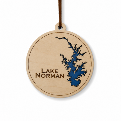 Layered wood Lake Norman ornament with blue lake detail and brown hanging cord on a clean light background.