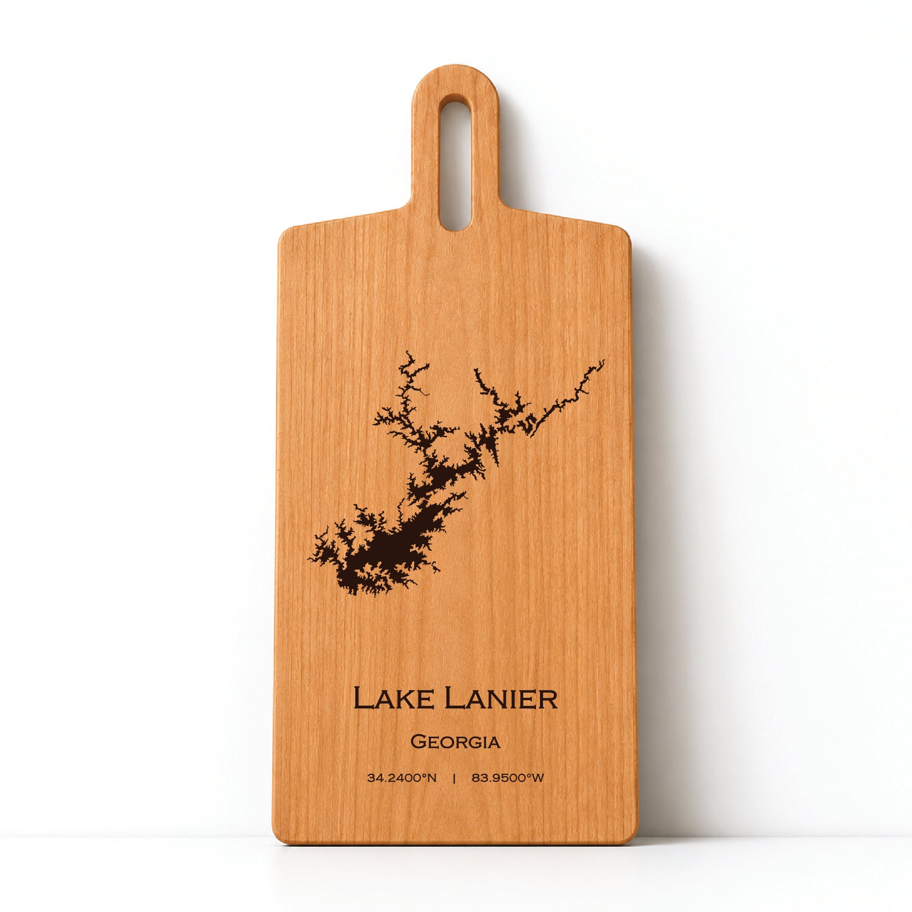 Minimal cherry wood serving board featuring engraved Lake Lanier shoreline and coordinates