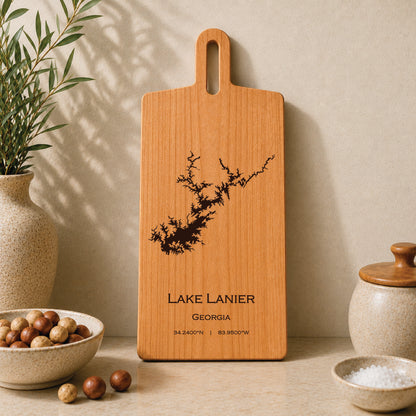 Lake Lanier engraved serving board displayed on a neutral kitchen countertop with ceramic decor