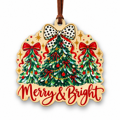 A wooden Christmas ornament featuring three decorated Christmas trees, red bows, gold stars, and the words 'Merry & Bright' in red script. The ornament has a scalloped edge and is suspended by a brown string on a white background.