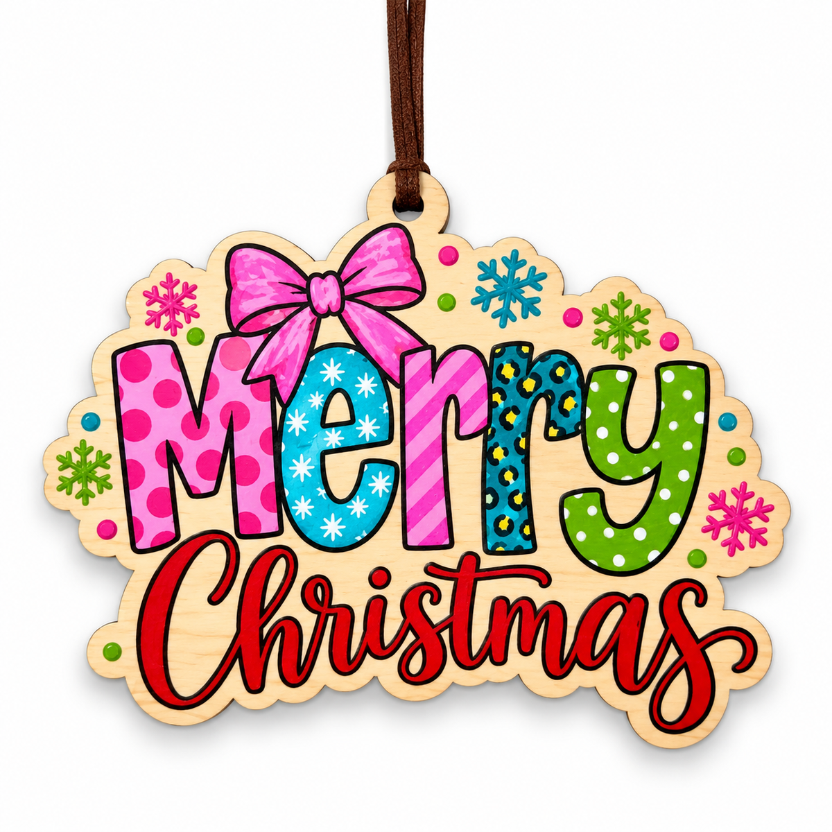 A wooden Christmas ornament with a natural wood border and a hanging loop, featuring the words 'Merry Christmas' in colorful patterned letters with snowflake and polka dot accents on a white background.