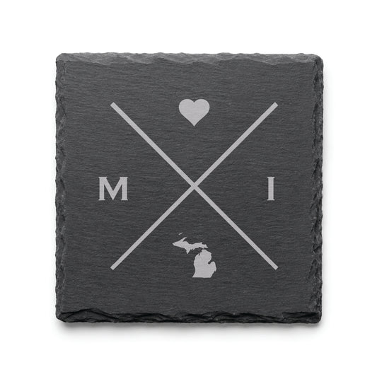 Engraved Michigan slate coaster featuring a minimalist crossed-line design with heart detail and Michigan silhouette on a clean light background.
