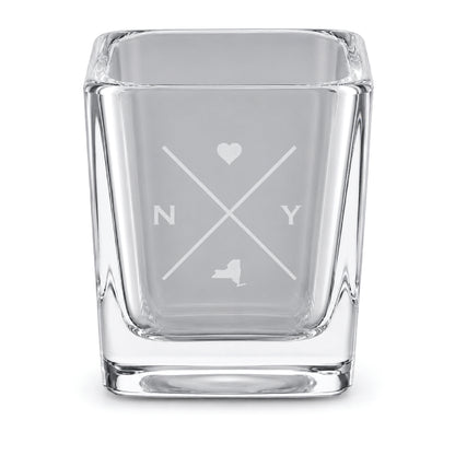Clear engraved New York shot glass featuring a minimalist crossed-line design with heart detail and New York silhouette on a clean light background.