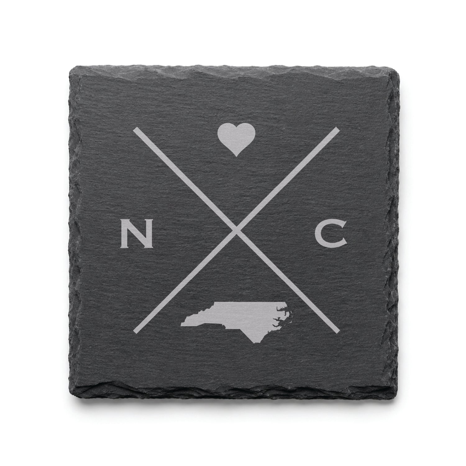 Engraved North Carolina slate coaster featuring a minimalist crossed-line design with heart detail and North Carolina silhouette on a clean light background.