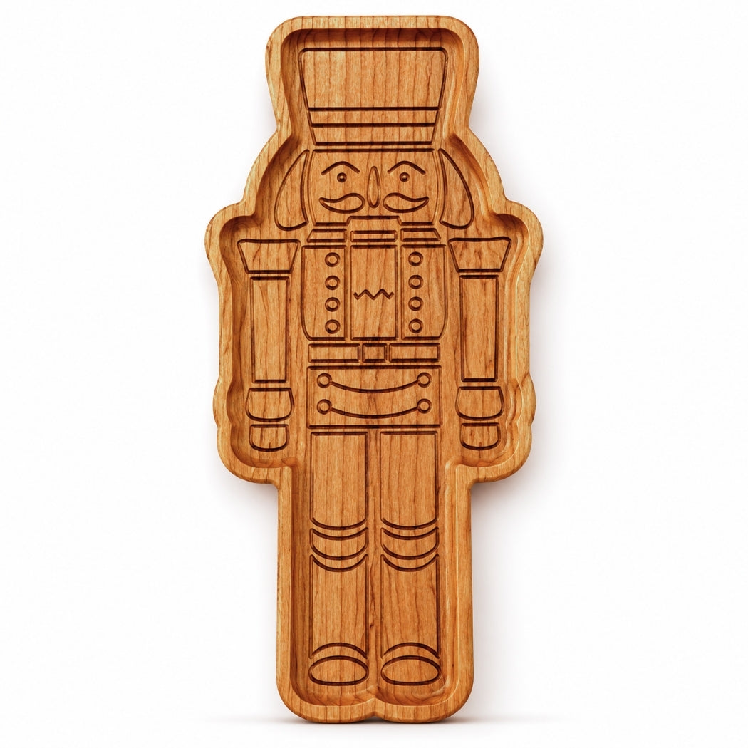 Cherry hardwood nutcracker serving tray standing upright on a clean white background with detailed engraved nutcracker design