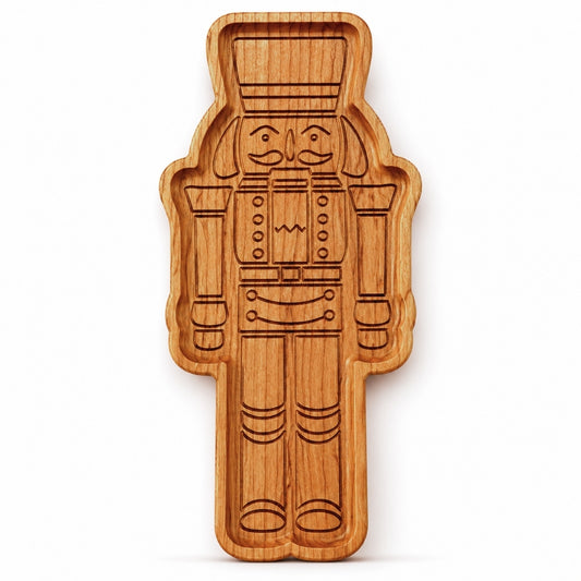 Cherry hardwood nutcracker serving tray standing upright on a clean white background with detailed engraved nutcracker design