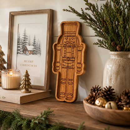 Lifestyle photo of a cherry hardwood nutcracker serving tray styled for holiday entertaining with festive décor.