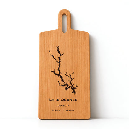 Minimal cherry wood serving board featuring engraved Lake Oconee shoreline and coordinates