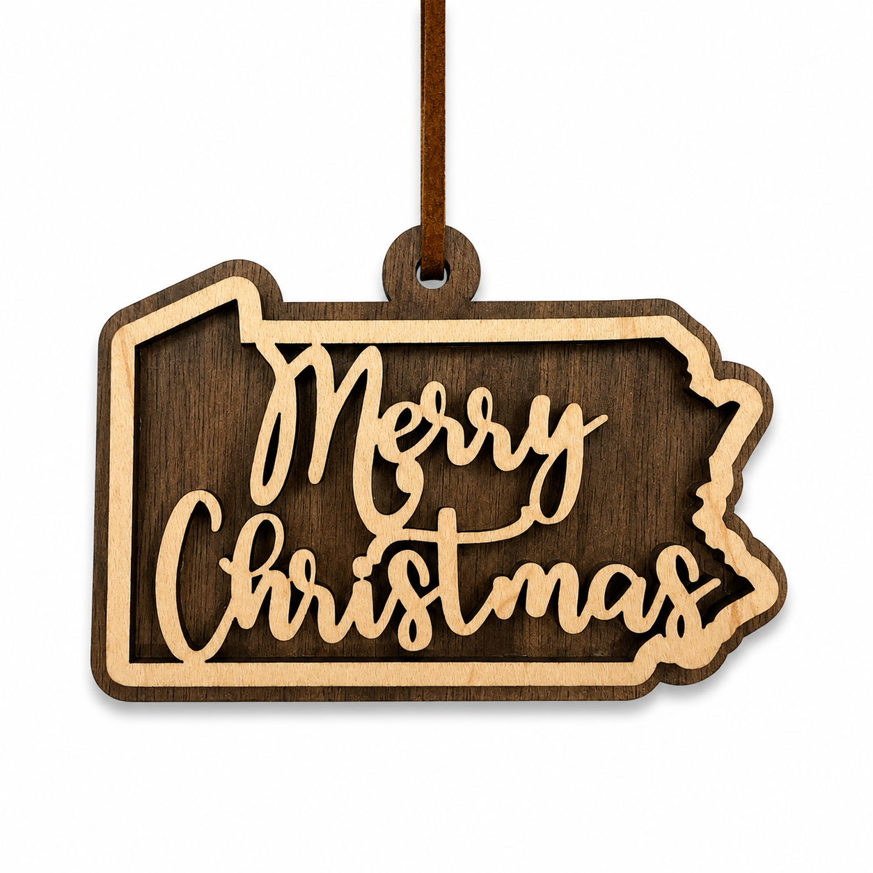 Wooden Christmas ornament shaped like Pennsylvania with 'Merry Christmas' text on a white background