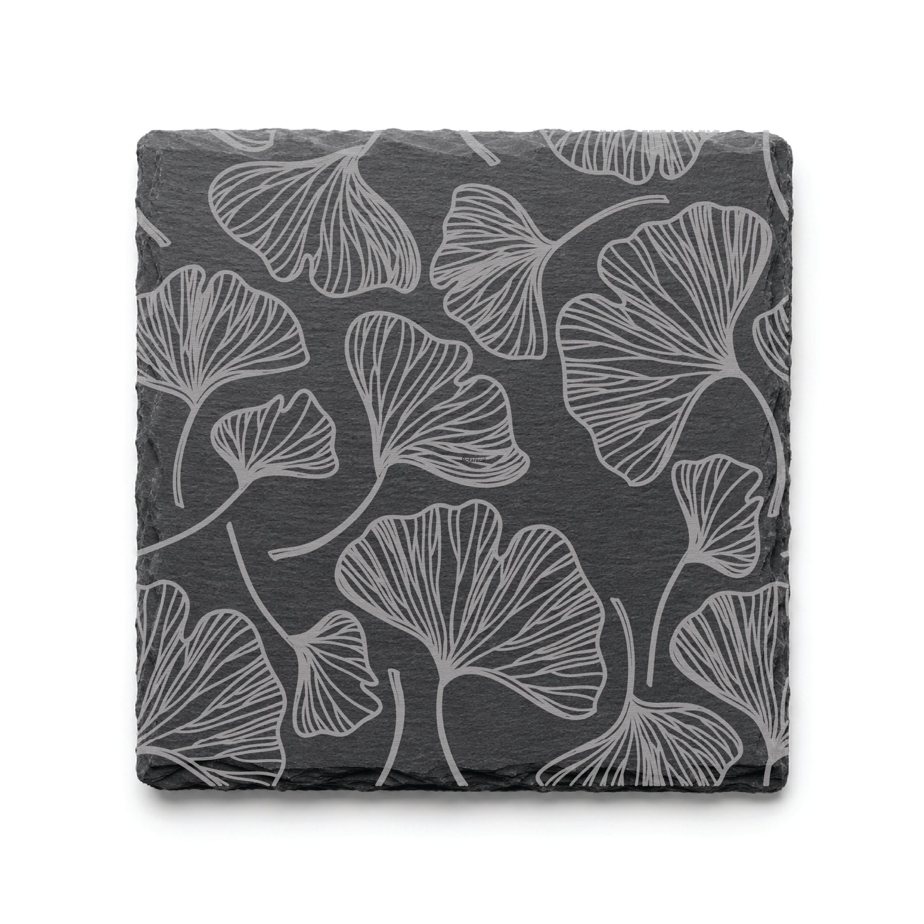 Botanical gingko leaf slate coaster with engraved leaf pattern on natural black slate background.