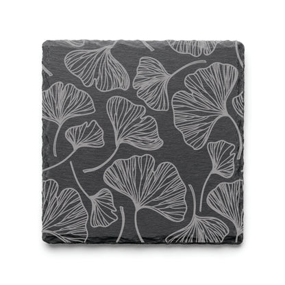 Botanical gingko leaf slate coaster with engraved leaf pattern on natural black slate background.