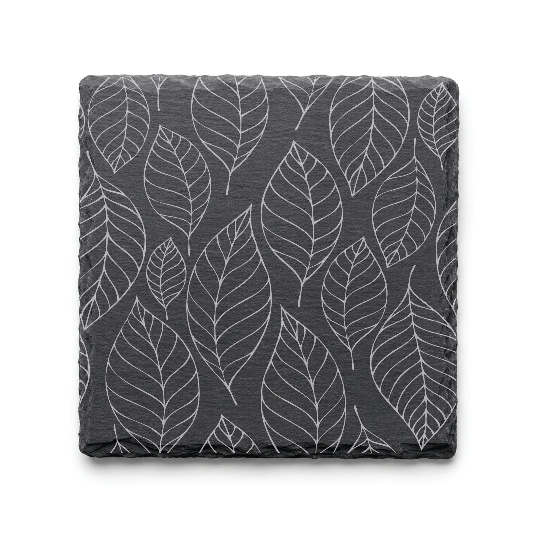 Slate coaster with engraved falling leaves pattern, showcasing detailed botanical leaf artwork on natural black slate.