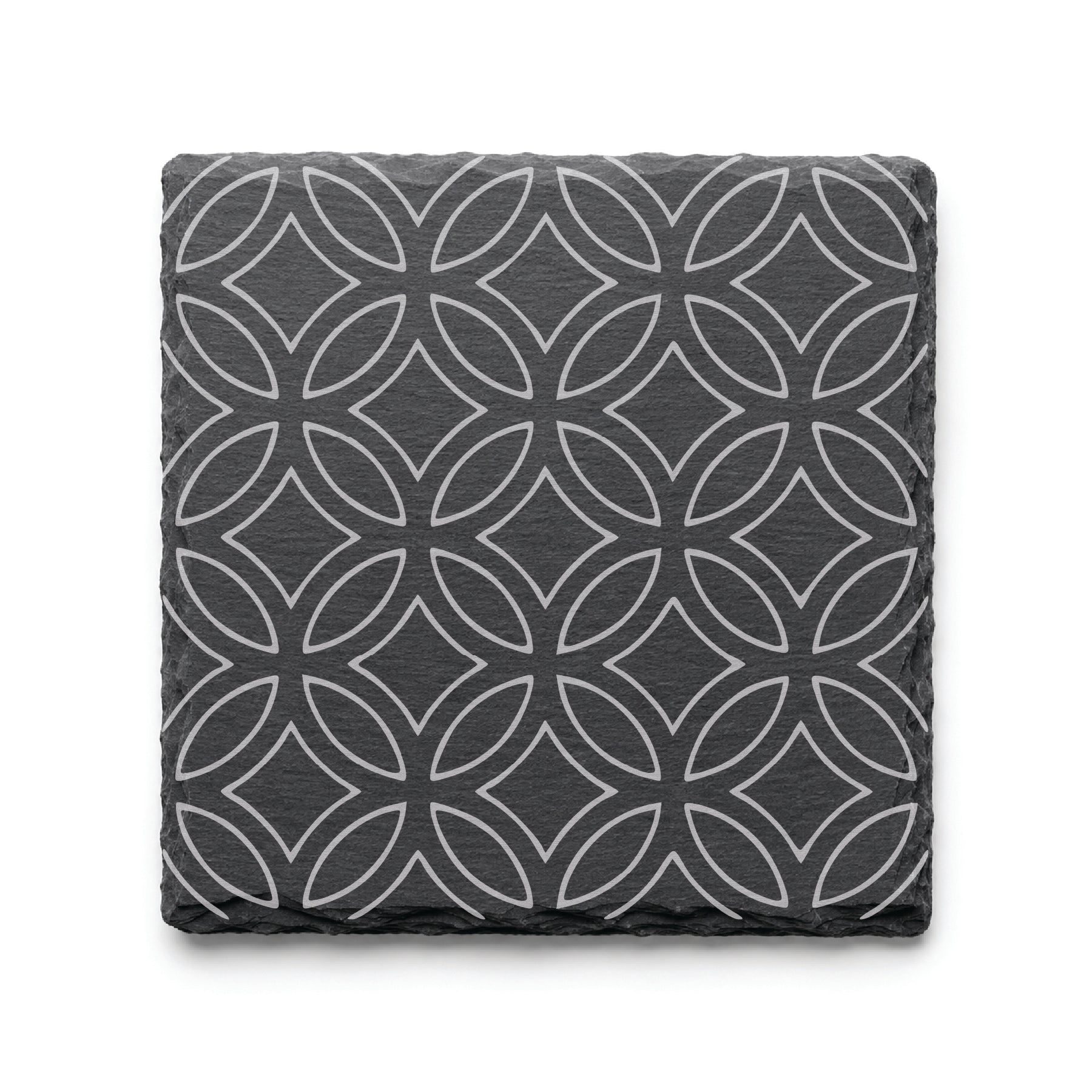 Geometric circle slate coaster with engraved repeating circular pattern on natural black slate background.