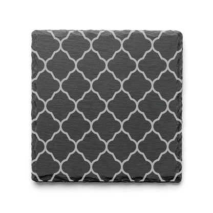 Quatrefoil engraved slate coaster featuring a classic geometric lattice pattern on natural black slate.