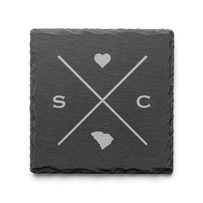 Engraved South Carolina slate coaster featuring a minimalist crossed-line design with heart detail and South Carolina silhouette on a clean light background.