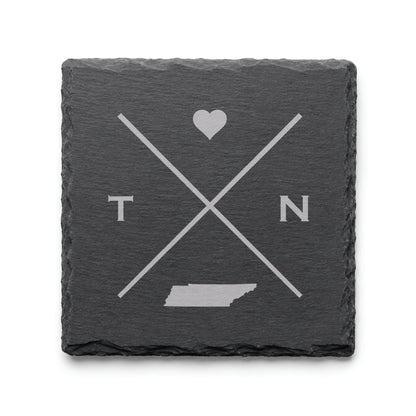 Engraved Tennessee slate coaster featuring a minimalist crossed-line design with heart detail and Tennessee silhouette on a clean light background.