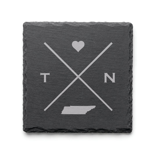 Engraved Tennessee slate coaster featuring a minimalist crossed-line design with heart detail and Tennessee silhouette on a clean light background.