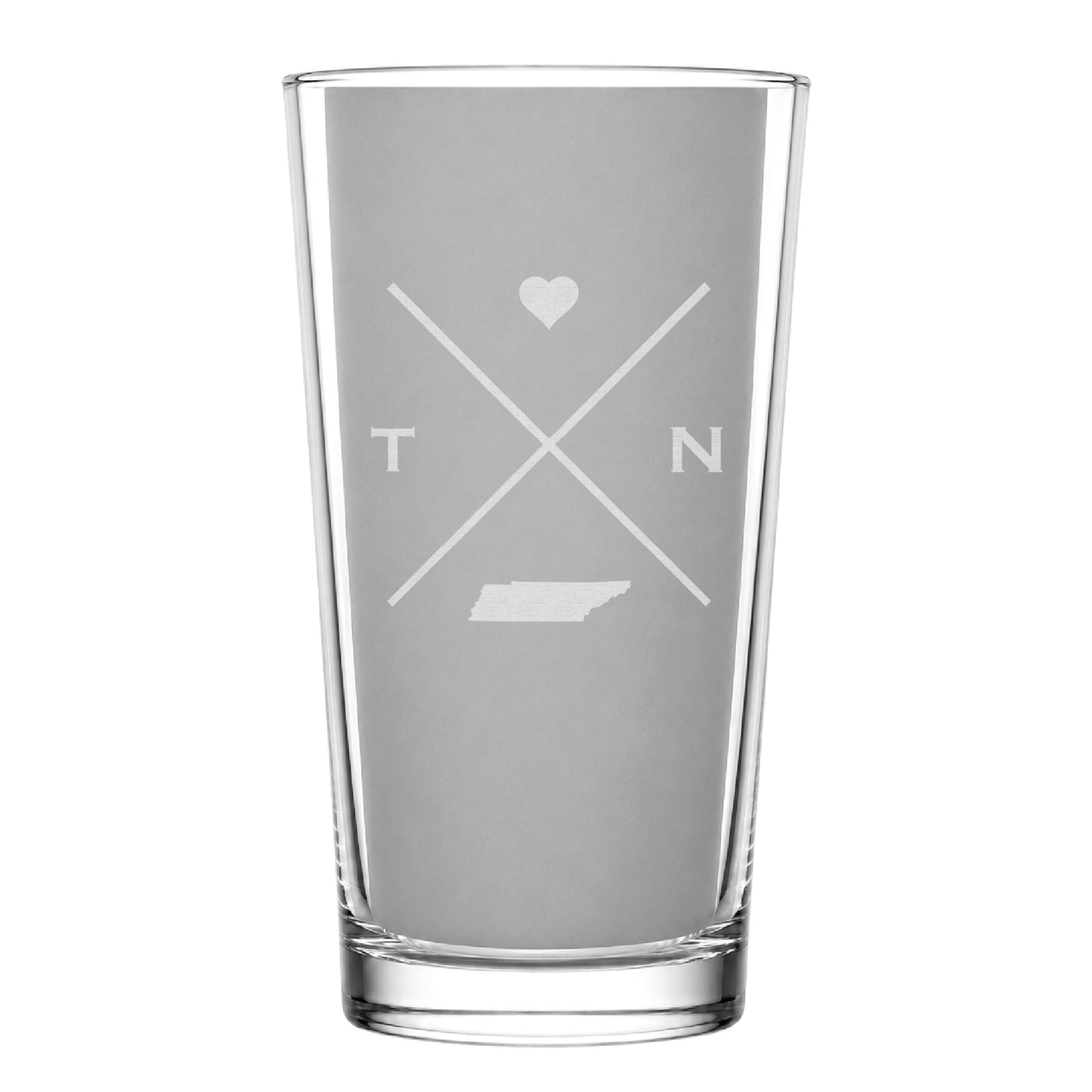 Clear pint glass with engraved Tennessee crossed-line design, heart icon, and Tennessee silhouette on a clean light background