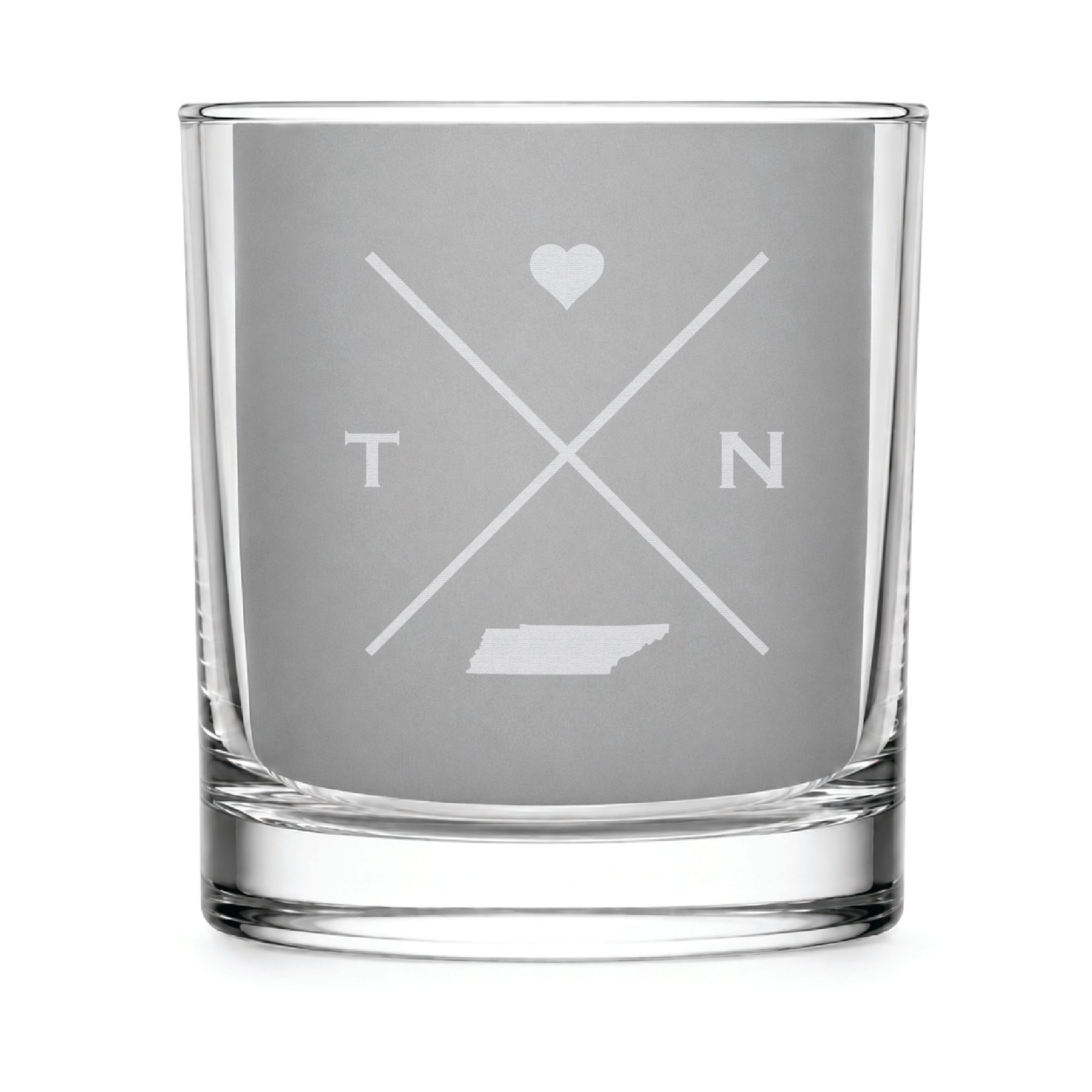Clear engraved rocks glass featuring a minimalist crossed-line Tennessee design with monogram initials, heart icon, and Tennessee silhouette on a clean light background.