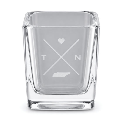 Clear engraved Tennessee shot glass featuring a minimalist crossed-line design with heart detail and Tennessee silhouette on a clean light background.