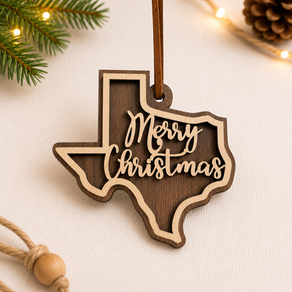 Wooden Texas-shaped ornament with 'Merry Christmas' text on a light background with Christmas decorations.