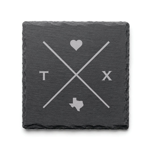 Engraved Texas slate coaster featuring a minimalist crossed-line design with heart detail and Texas silhouette on a clean light background.