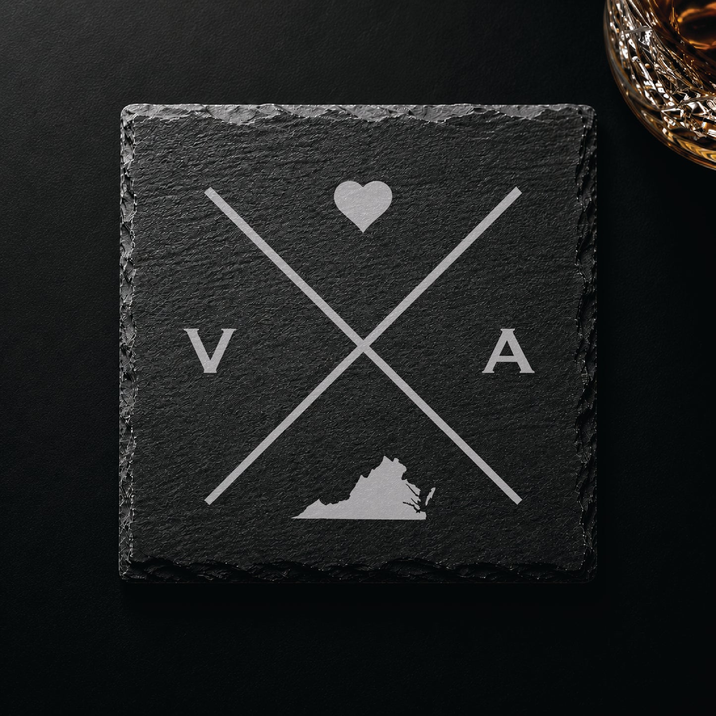Dark slate coaster with engraved Virginia crossed-line design, heart icon, and Virginia silhouette on a dark background.