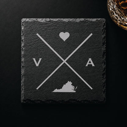 Dark slate coaster with engraved Virginia crossed-line design, heart icon, and Virginia silhouette on a dark background.
