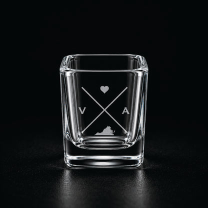 Engraved Virginia shot glass with modern crossed-line state design and frosted laser engraving on a dark background.